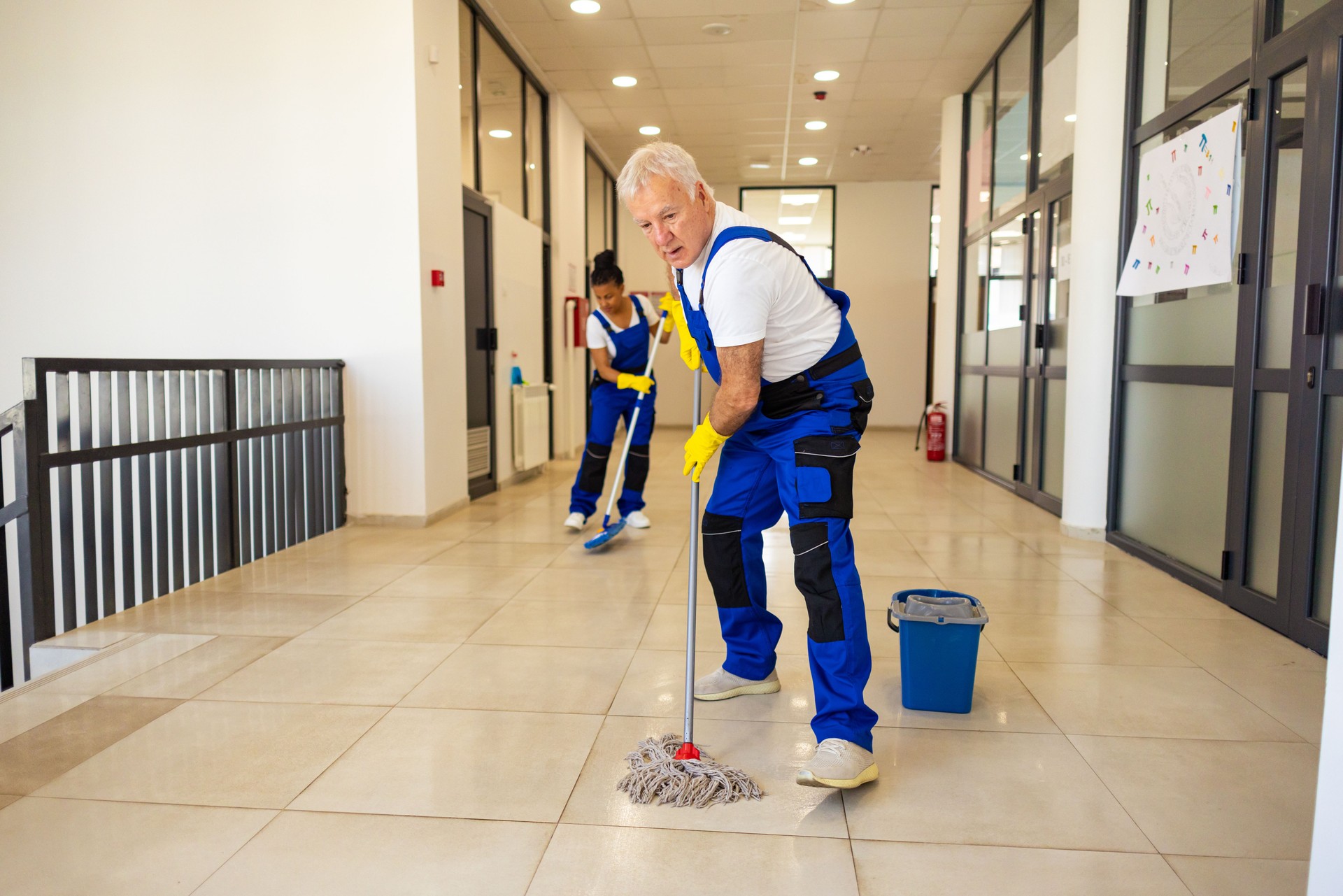 Janitors cleaning the school floor